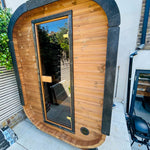 Camilla Compact outdoor sauna kit installed in a garden