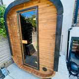 Camilla Compact outdoor sauna kit installed in a garden