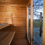 Leil Aris Lite interior corner showing the bench layout, ThermoWood walls and bronze glass front