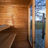 Leil Aris Lite interior corner showing the bench layout, ThermoWood walls and bronze glass front
