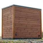 Back view of the Leil Aris Lite outdoor sauna showing ThermoWood rear wall and ventilation opening