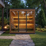 Leil Aris Lite four person outdoor sauna installed on a garden path with warm interior lighting