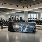 Icefall ice bath shown in an indoor wellness and gym recovery room beside training equipment.